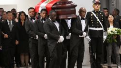 The coffin of late Peru's former president Alberto Fujimori arrives for his wake at the Culture Ministry in Lima on September 12, 2024. Peru's former president Alberto Fujimori, who ruled his country with an iron fist and then spent 16 years in prison for crimes against humanity, died on Wednesday at age 86 in the capital Lima. (Photo by CRIS BOURONCLE / AFP) (Photo by CRIS BOURONCLE/AFP via Getty Images)