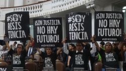 TOPSHOT - Local deputies take part in a protest holding signs that read in Spanish "Without justice, there is no future!" against the judicial reform in the Congress of Mexico City on September 12, 2024. Mexican President Andrés Manuel López Obrador announced on Thursday that his controversial judicial reform, which provides for the election of all judges by popular vote, is ready to be enacted after winning the support of 18 state congresses. (Photo by Silvana FLORES / AFP) (Photo by SILVANA FLORES/AFP via Getty Images)