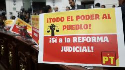 Signs that read in Spanish: "All power to the people, yes to the judicial reform" are seen during the vote in the Congress of Mexico City on the Judicial Reform in Mexico City on September 12, 2024. Mexican President Andrés Manuel López Obrador announced on Thursday that his controversial judicial reform, which provides for the election of all judges by popular vote, is ready to be enacted after winning the support of 18 state congresses. (Photo by Silvana FLORES / AFP) (Photo by SILVANA FLORES/AFP via Getty Images)