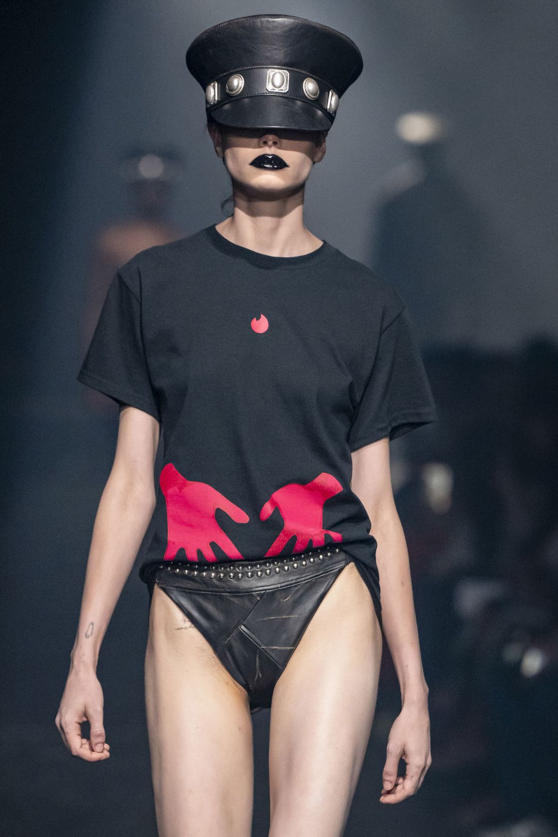 A Tinder-branded tee on the Area runway.