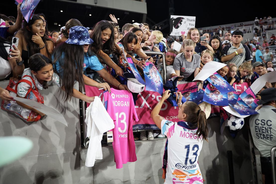 Morgan signs autographs after her final career game.