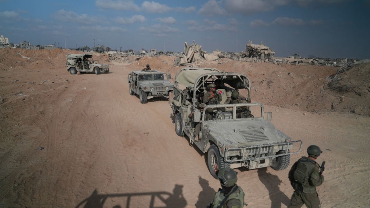 TOPSHOT - --PHOTO TAKEN DURING A CONTROLLED TOUR AND SUBSEQUENTLY EDITED UNDER THE SUPERVISION OF THE ISRAELI MILITARY--
Israeli soldiers patrol a road in Rafah in the Gaza Strip on September 13, 2024, amid the ongoing war between Israel and Palestinian militant groups. (Photo by Sharon ARONOWICZ / AFP) (Photo by SHARON ARONOWICZ/AFP via Getty Images)