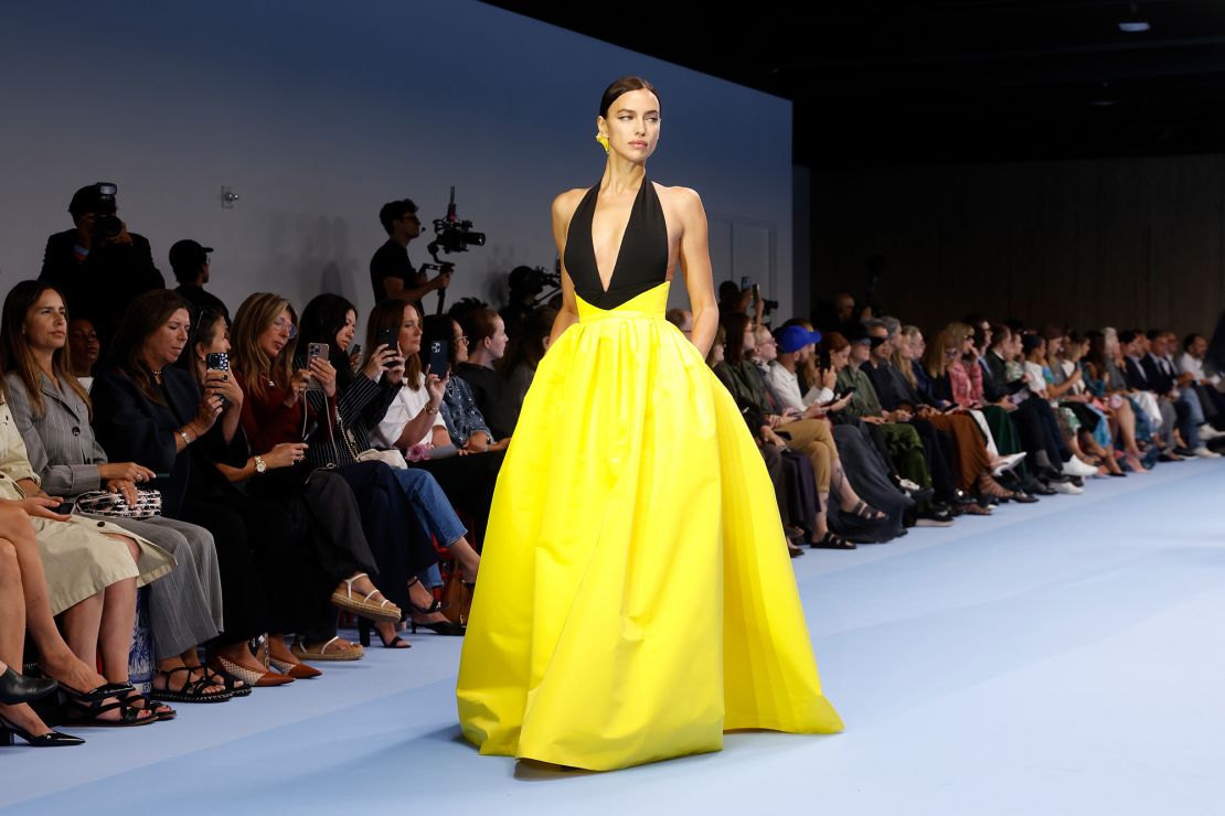 Irina Shayk walked for Carolina Herrera in a plunging halter gown with a burst of canary yellow.