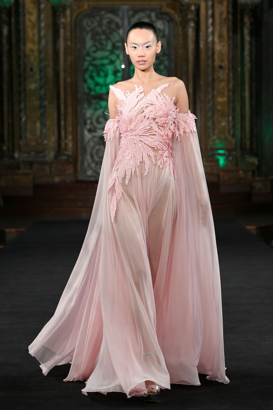 Kahn’s second collection included intricate gowns inspired by the film adaptation of “Wicked” in the musical’s famed color scheme of pink and green.