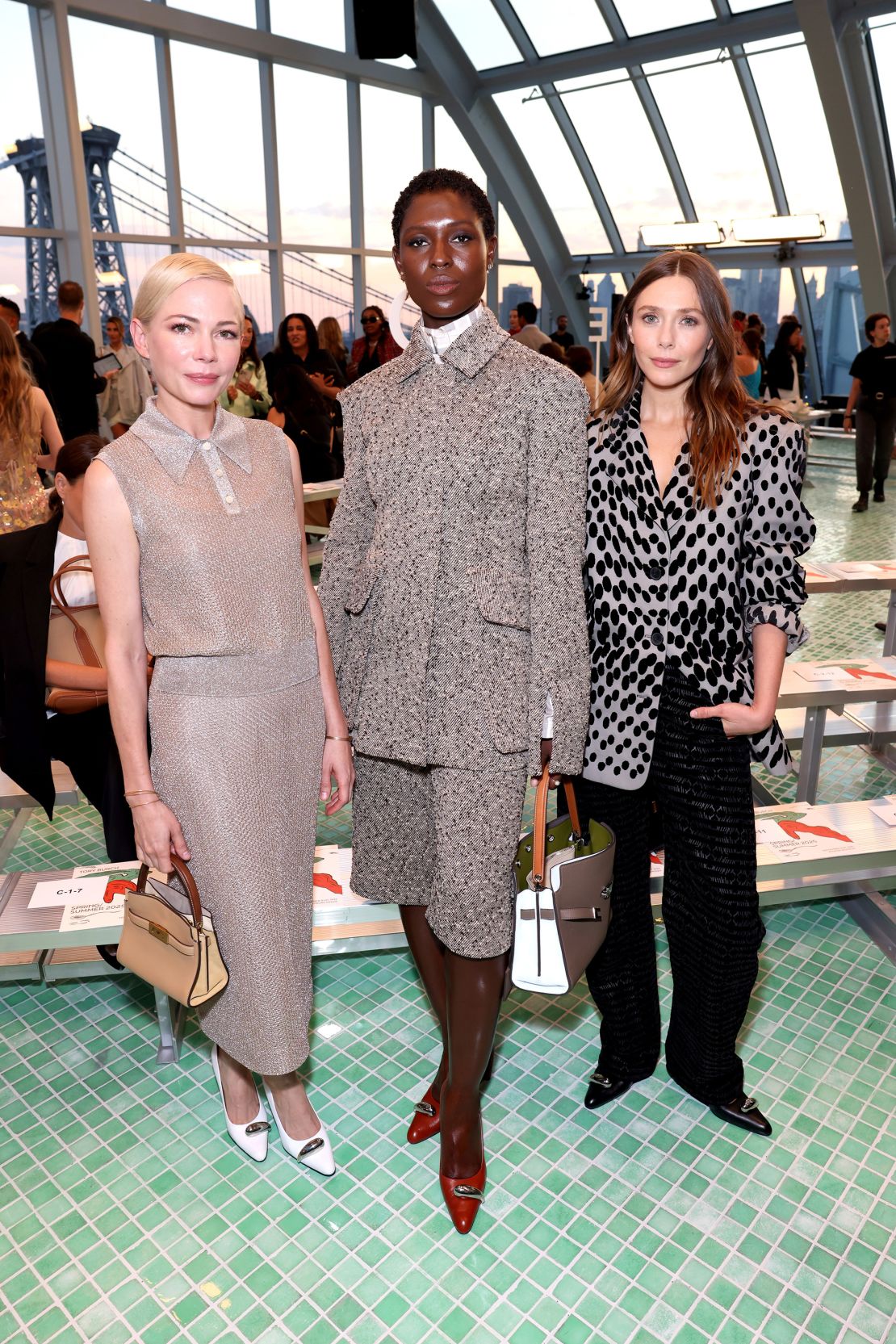 Michelle Williams, Jodie Turner-Smith and Elizabeth Olsen in the teal-tiled Brooklyn skylight where Tory Burch hosted her latest collection.