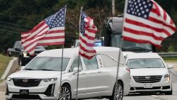 JEFFERSON, GEORGIA - SEPTEMBER 14: A hearse carrying the casket of Apalachee School shooting victim Mason Schermerhorn enters the Jefferson Civic Center for his memorial service on September 14, 2024 in Jefferson, Georgia. The family requested that attendees wear red, which was his favorite color. Four people were killed and nine others injured by a 14-year-old gunman at Apalachee High School on September 4. School on September 4. (Photo by Elijah Nouvelage/Getty Images)