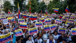 MADRID, SPAIN - SEPTEMBER 10: Venezuelan opposition supporters hold placards reading 'For the freedom of Venezuela' demonstrate outside the Spanish Parliament on support of their leader Edmundo Gonzalez on September 10, 2024 in Madrid, Spain. Venezuelan opposition candidate Edmundo Gonzalez arrived in Spain on Sunday after fleeing Caracas, following a negotiated deal with Nicolás Maduro's government a week after authorities issued an arrest warrant accusing him of conspiracy. Gonzalez, who had alleged election fraud by President Maduro in the disputed July 28 vote, left amid escalating tensions and a harsh crackdown on protests. (Photo by Pablo Blazquez Dominguez/Getty Images)