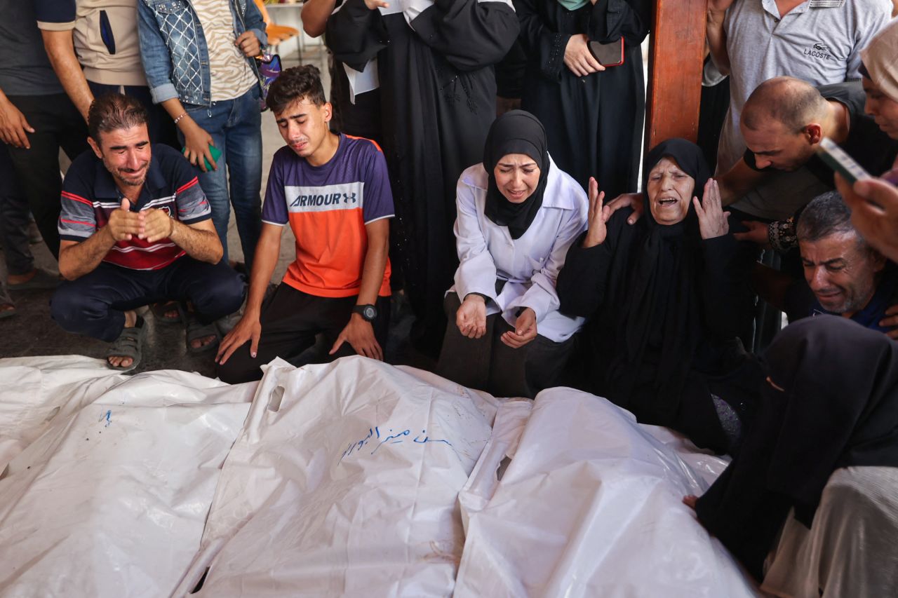 Palestinians mourn over the the bodies of a family killed by an Israeli bombardment in Gaza City on September 15.