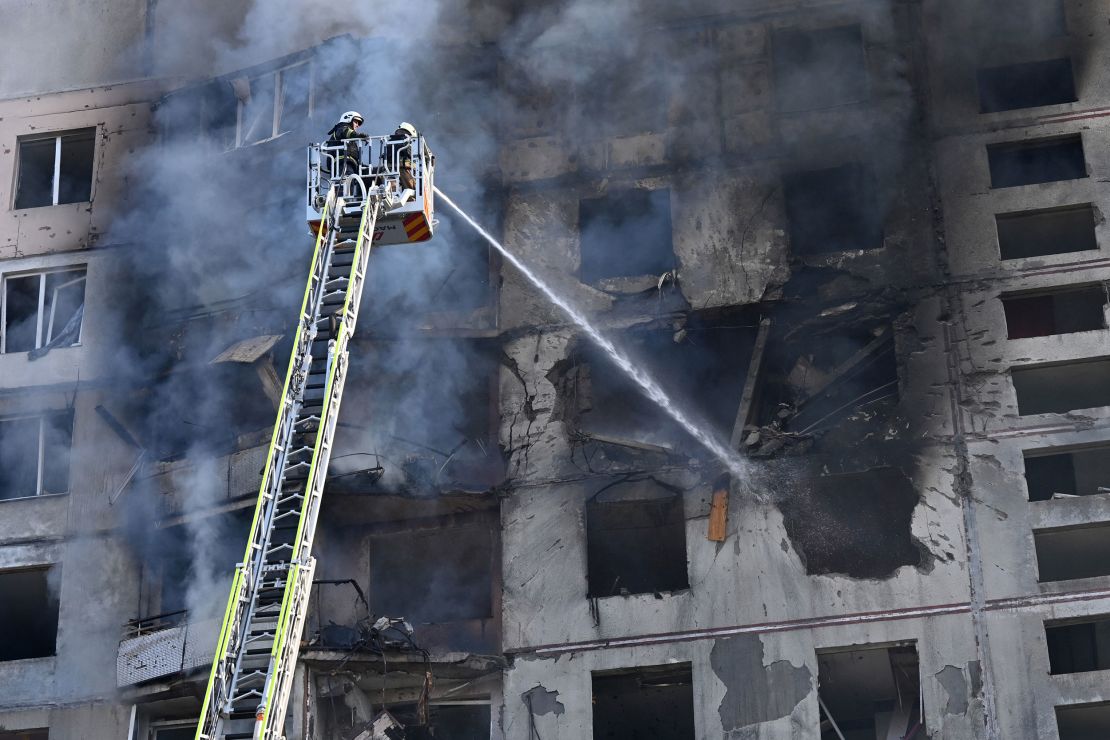 Ukrainian rescuers work to extinguish a fire in a residential building following a missile attack in Kharkiv on September 15, 2024, amid the Russian invasion of Ukraine.