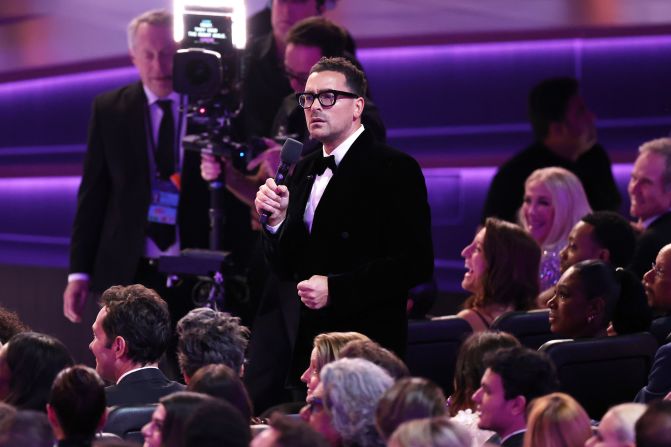 Co-host Dan Levy speaks from the audience at the Peacock Theater.