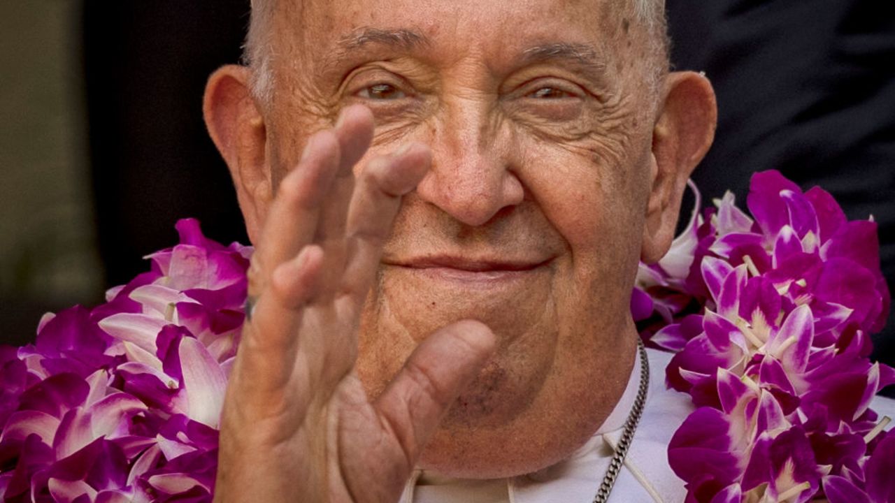 SINGAPORE, SINGAPORE - SEPTEMBER 13: Pope Francis waves to well wishers as he arrives for an interreligious dialogue with the youth at the Catholic Junior College on September 13, 2024 in Singapore. Pope Francis embarked on a historic 12-day tour of Southeast Asia, which took in Indonesia, Papua New Guinea, East Timor, and Singapore. The 87-year-old pontiff aimed to promote interfaith dialogue and address issues like climate change during his longest trip yet as leader of the Catholic Church. (Photo by Ezra Acayan/Getty Images)