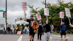 Striking Boeing workers and their supporters picket outside the Boeing factory in Renton, Washington, on September 16. A tentative deal has been reached that could end the five-week-long strike.