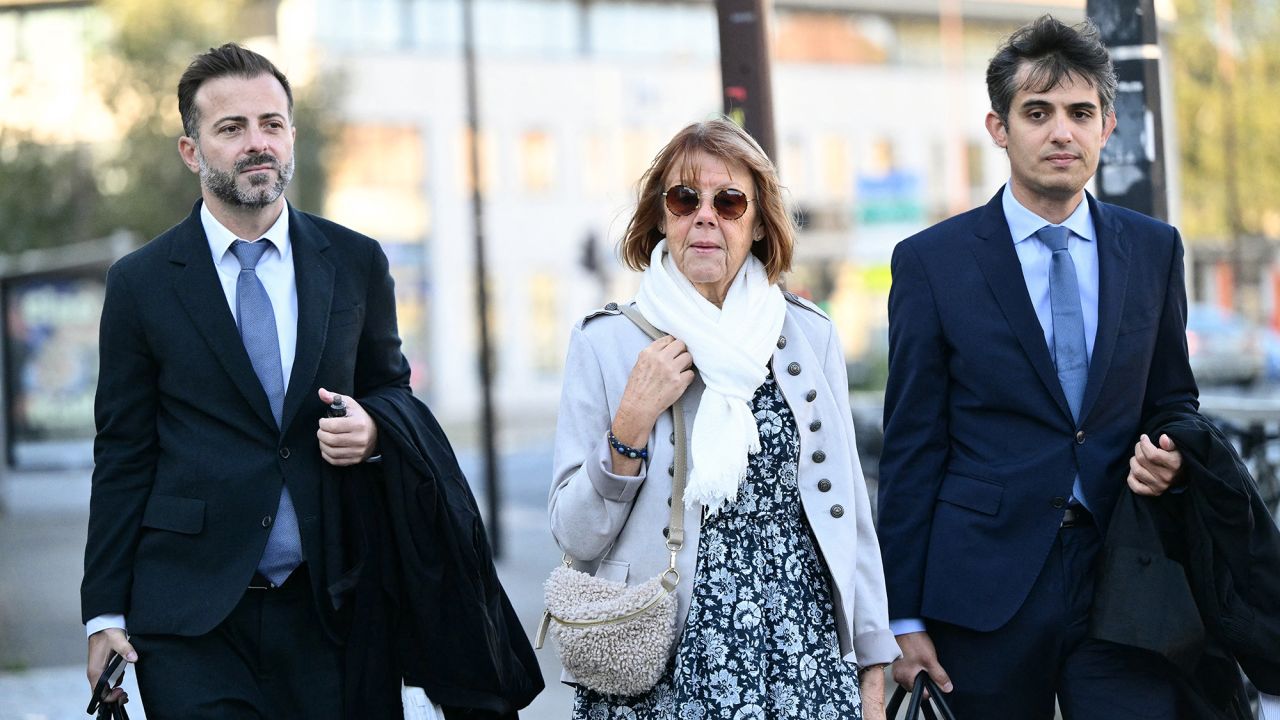 Gisele Pelicot (C) arrives with her lawyers Stephane Babonneau (R) and Antoine Camus at the Avignon courthouse during the trial of her former partner Dominique Pelicot accused of drugging her for nearly ten years and inviting strangers to rape her at their home in Mazan, a small town in the south of France, in Avignon, on September 17, 2024. A court in the southern town of Avignon is trying Dominique Pelicot, a 71-year-old retiree, for repeatedly raping and enlisting dozens of strangers to rape his heavily sedated wife in her own bed over a decade. Fifty other men, aged between 26 and 74, are also on trial for alleged involvement, in a case that has horrified France. The court proceedings, which runs until December, are open to the public at the request of Dominique Pelicot's ex-wife and victim. (Photo by Christophe SIMON / AFP) (Photo by CHRISTOPHE SIMON/AFP via Getty Images)