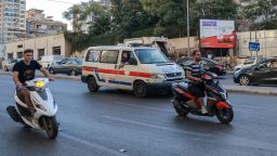 A Lebanese Red Cross ambulance rushes wounded people to a hospital in Beirut on September 17, 2024, after explosions hit locations in several Hezbollah strongholds around the country amid ongoing cross-border tensions between Israel and Hezbollah fighters. Hundreds of people were wounded when Hezbollah members' paging devices exploded simultaneously across Lebanon on September 17, in what a source close to the militant movement said was an "Israeli breach" of its communications. (Photo by Ibrahim AMRO / AFP) (Photo by IBRAHIM AMRO/AFP via Getty Images)