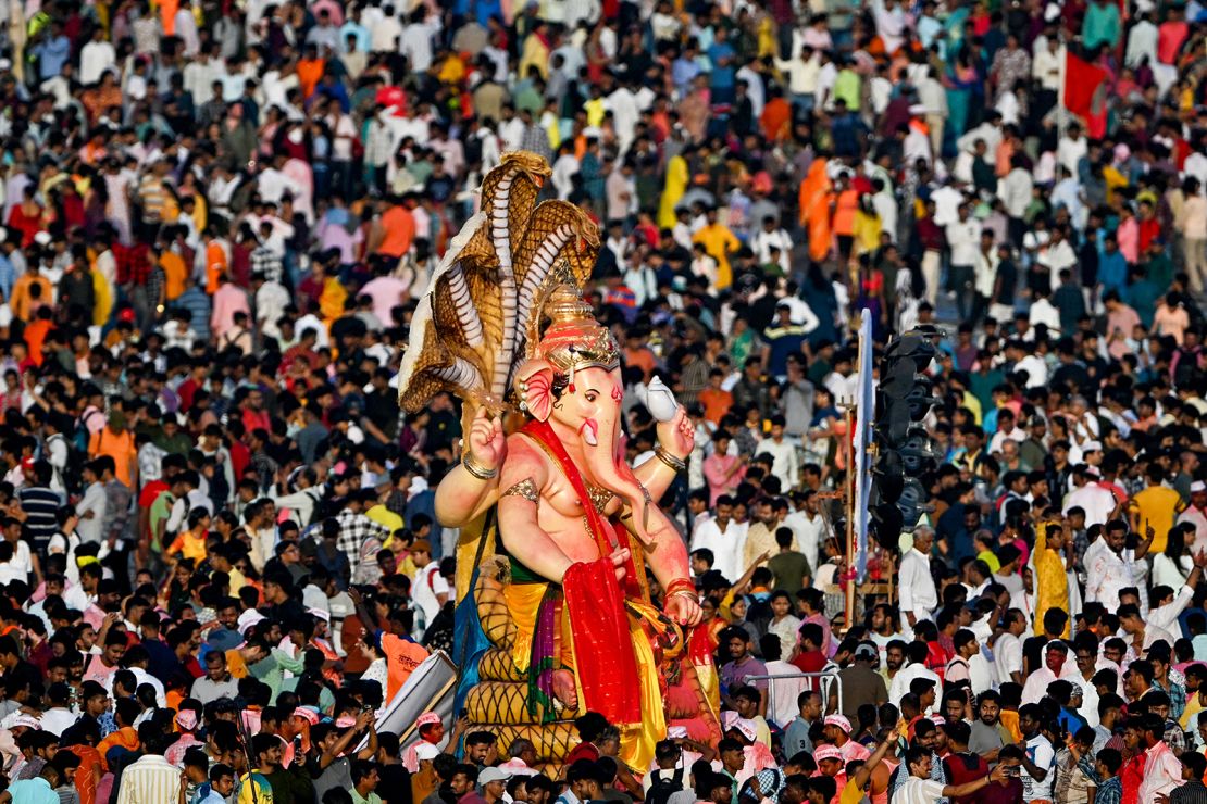 An idol of the elephant-headed Hindu deity Ganesha is paraded before its immersion in the Arabian sea in Mumbai on September 17, 2024.