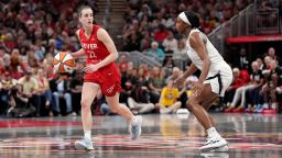 Caitlin Clark of the Indiana Fever, left, drives the ball up court against Jackie Young of the Las Vegas Aces during the first half of a game at Gainbridge Fieldhouse in Indianapolis, Indiana, on September 13, 2024.