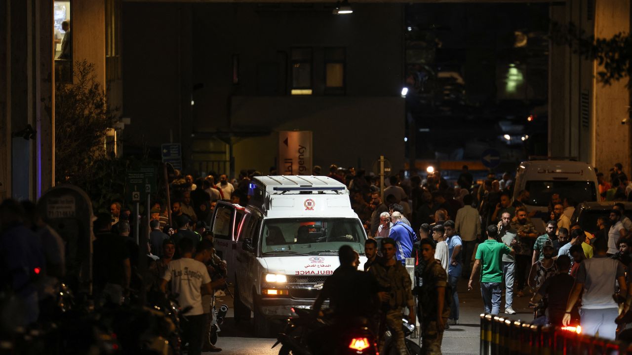 Ambulances are surrounded by people at the entrance of the American University of Beirut Medical Center, on September 17, 2024, after explosions hit locations in several Hezbollah strongholds around Lebanon amid ongoing cross-border tensions between Israel and Hezbollah fighters. Hundreds of people were wounded when Hezbollah members' paging devices exploded simultaneously across Lebanon on September 17, in what a source close to the militant movement said was an "Israeli breach" of its communications. (Photo by ANWAR AMRO / AFP) (Photo by ANWAR AMRO/AFP via Getty Images)