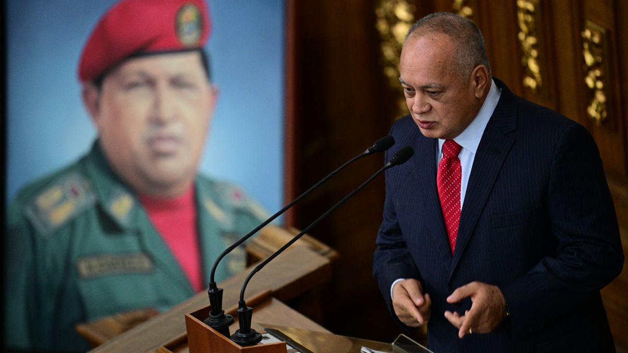 Venezuela's Interior Minister Diosdado Cabello speaks next to a painting of the late Venezuelan President Hugo Chavez during a session at the National Assembly in Caracas on September 17, 2024. Venezuela said Tuesday it had arrested a fourth US citizen over what it claims was a plot to assassinate President Nicolas Maduro in the aftermath of elections the opposition claims he stole. (Photo by Federico PARRA / AFP) (Photo by FEDERICO PARRA/AFP via Getty Images)