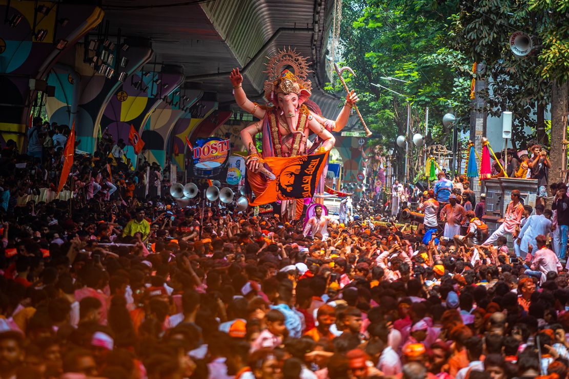 Devotees parade with a large idol of elephant-headed Hindu god Ganesh in Mumbai, India, on September 17, 2024.