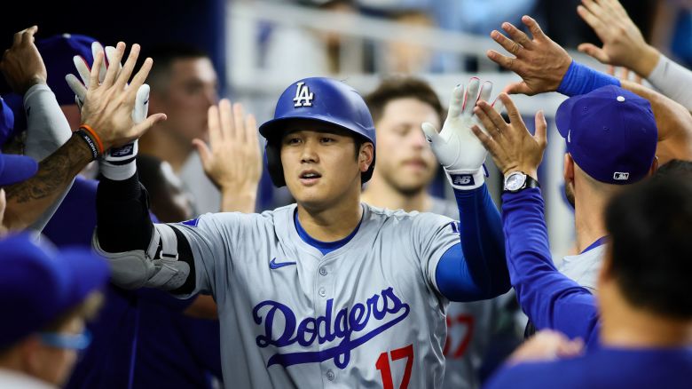 MIAMI, FLORIDA - SEPTEMBER 17: Shohei Ohtani #17 of the Los Angeles Dodgers celebrates with teammates after hitting a two-run home run against the Miami Marlins during the third inning at loanDepot park on September 17, 2024 in Miami, Florida. (Photo by Sam Navarro/Getty Images)