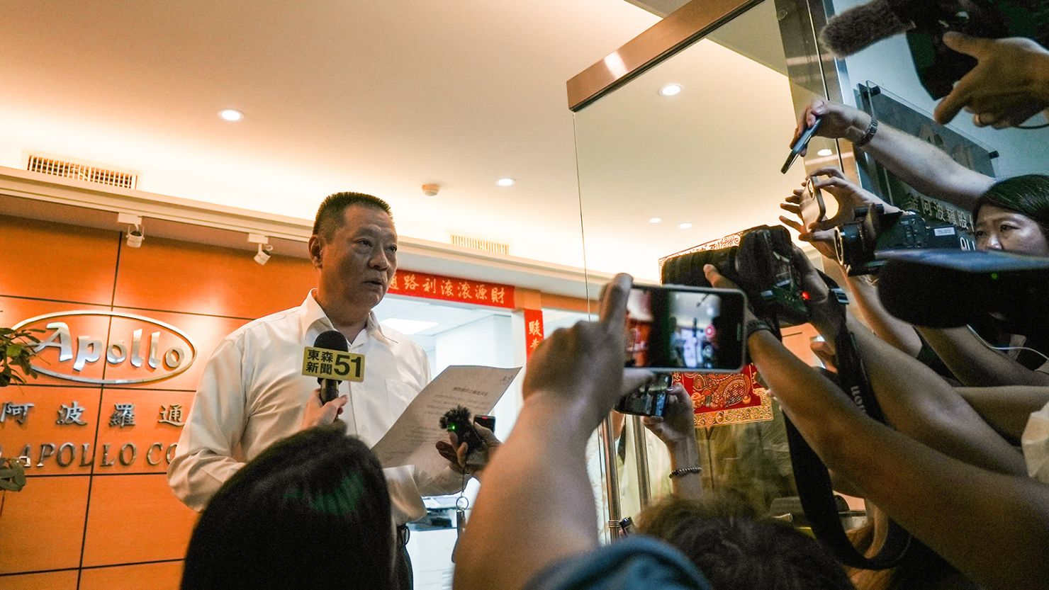 Hsu Ching-kuang, founder of Taiwanese company Gold Apollo, speaks to the media outside the company's office in New Taipei City on September 18.