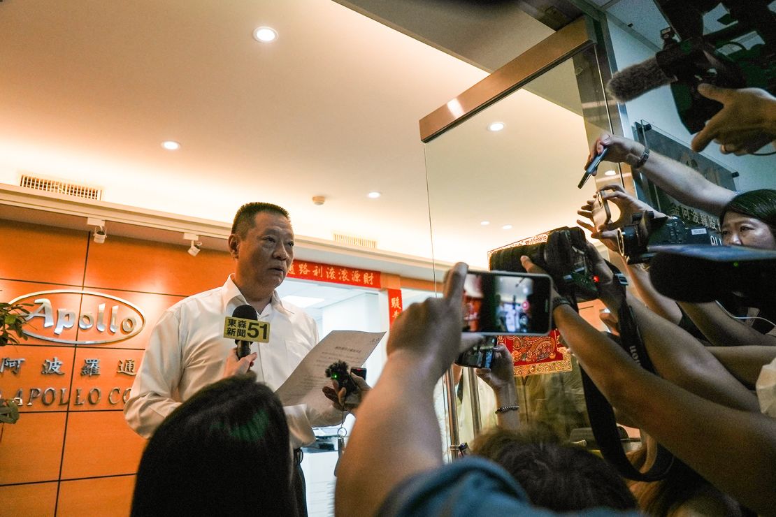 Hsu Ching-kuang (L), head of Taiwanese company Gold Apollo, speaks to the media outside the company's office in New Taipei City on September 18, 2024.