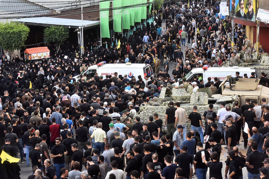 Ambulances arrive after a device explosion occurred in the southern suburbs of Beirut on September 18, 2024, during the funeral of people who died when hundreds of pagers exploded the previous day in a deadly wave across Lebanon.