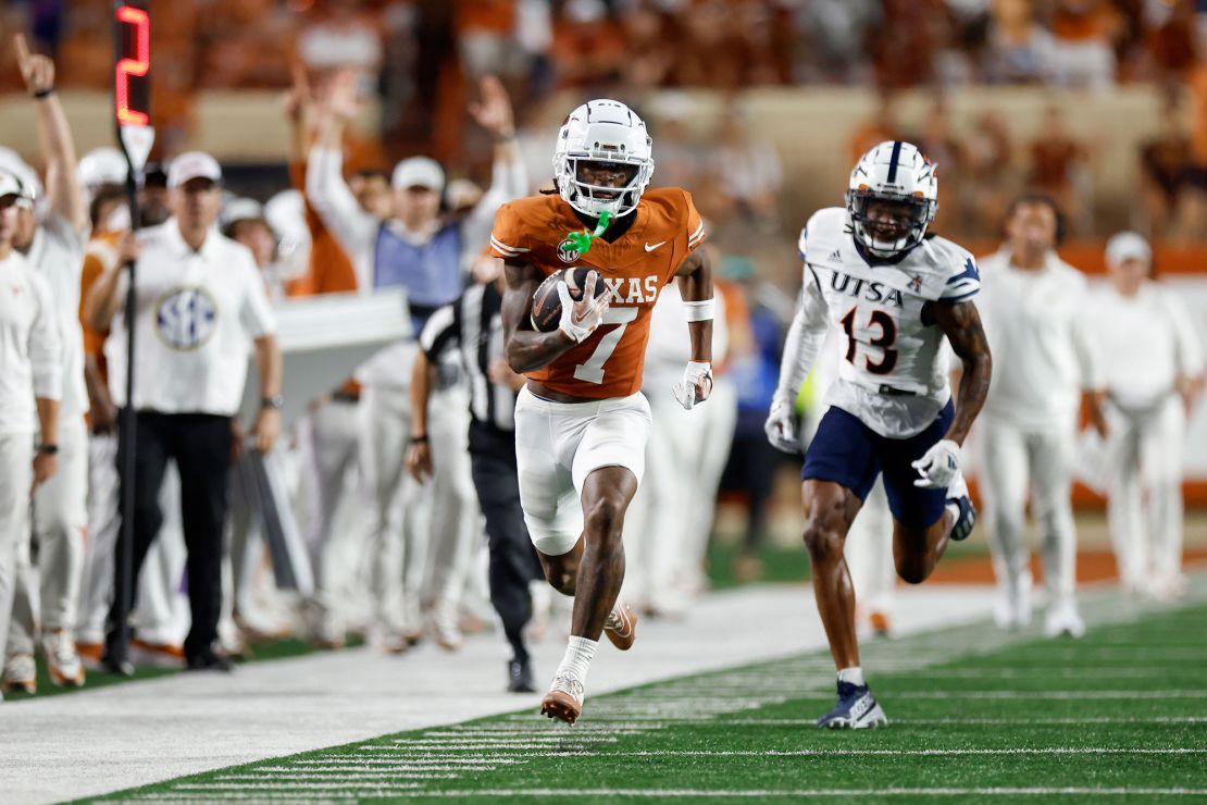 Isaiah Bond of the Texas Longhorns catches a pass and runs for a touchdown during the second half against the UTSA Roadrunners.