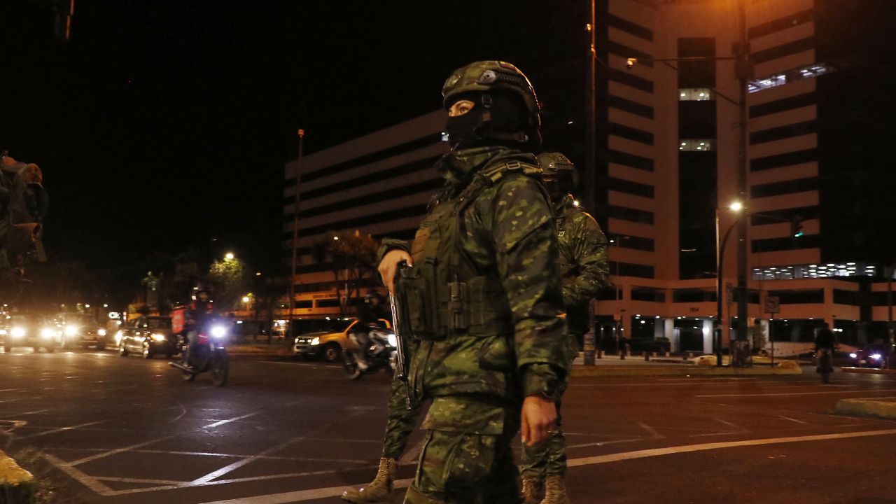 Ecuadorian soldiers patrol a street before a national scheduled eight-hour blackout in Quito on September 18, 2024. Ecuador will be in darkness on Wednesday night due to a scheduled eight-hour blackout for transmission system maintenance, in the midst of a power crisis resulting from the worst drought in 60 years. (Photo by Galo Paguay / AFP) (Photo by GALO PAGUAY/AFP via Getty Images)