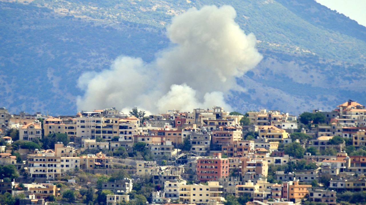 TOPSHOT - Smoke billows from the site of an Israeli airstrike in the southern Lebanese village of Khiam near the border on September 19, 2024. Lebanon's Hezbollah has traded near-daily fire with Israeli forces in support of ally Hamas since the Palestinian militant group's October 7 attack triggered war in the Gaza Strip, with repeated escalations during more than 11 months of the cross-border violence. (Photo by AFP) (Photo by -/AFP via Getty Images)
