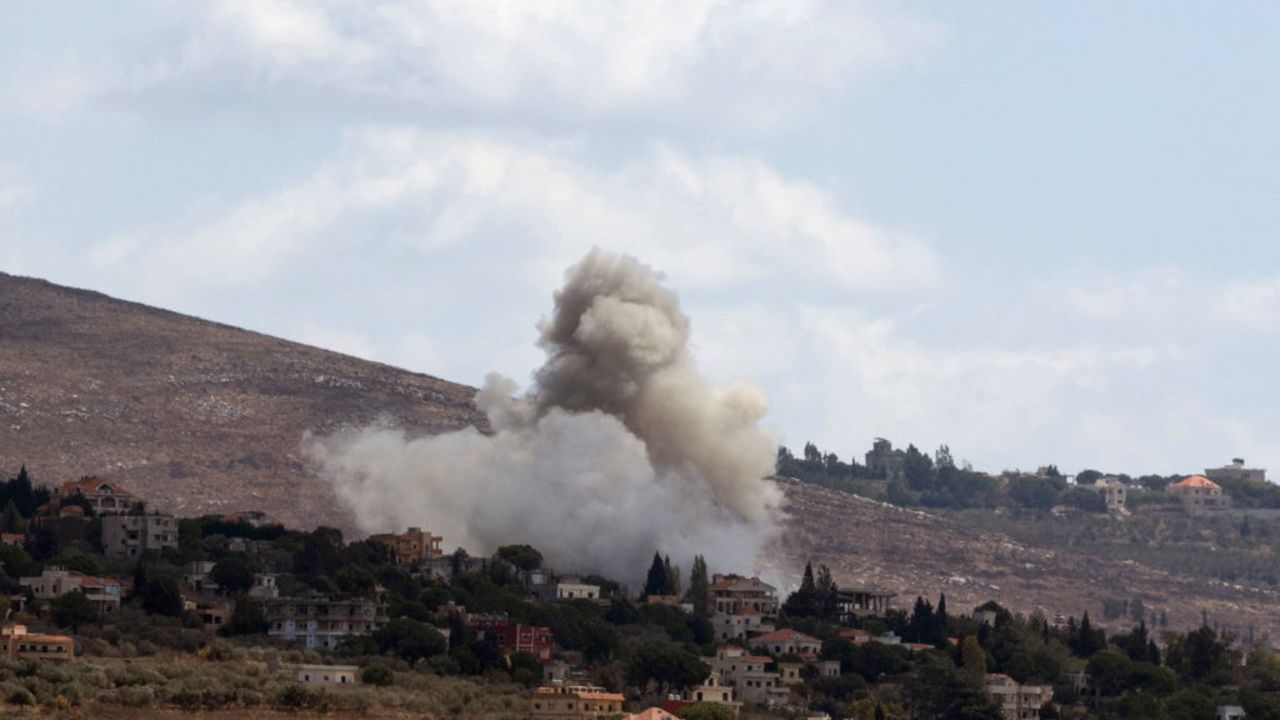 Smoke billows from the site of an Israeli airstrike that targeted an area in the southern Lebanese village of al-Taybeh on September 19, 2024. Lebanon's Hezbollah has traded near-daily fire with Israeli forces in support of ally Hamas since the Palestinian militant group's October 7 attack triggered war in the Gaza Strip, with repeated escalations during more than 11 months of the cross-border violence. (Photo by AMMAR AMMAR / AFP) (Photo by AMMAR AMMAR/AFP via Getty Images)