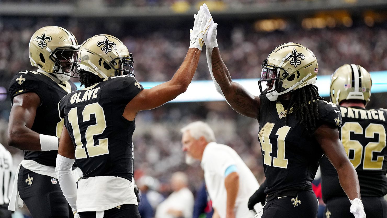 Alvin Kamara (right) scored four touchdowns as the New Orleans Saints beat the Dallas Cowboys.