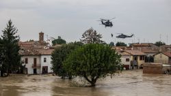 TOPSHOT - People are evacuated by helicopters of the Italian Air Force during floods in the small village of Traversara, on September 19, 2024. Many inhabitants were caught by the flood are still stuck in their homes sourrounded by water. The strong winds and rains which have swept across central and eastern Europe, killing 24 people, pummeled the Emilia-Romagna and Marche regions, with over 1,000 people evacuated from homes. (Photo by Federico SCOPPA / AFP) (Photo by FEDERICO SCOPPA/AFP via Getty Images)