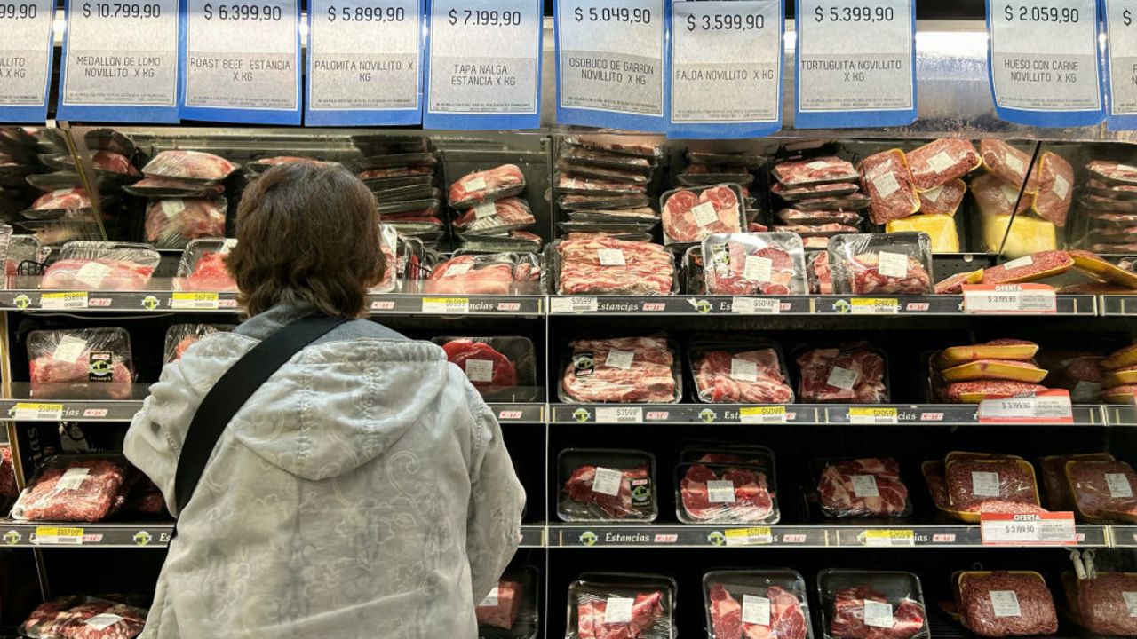 A woman checks prices of beef at a supermarket in Buenos Aires on September 19, 2024. (Photo by STRINGER / AFP) (Photo by STRINGER/AFP via Getty Images)