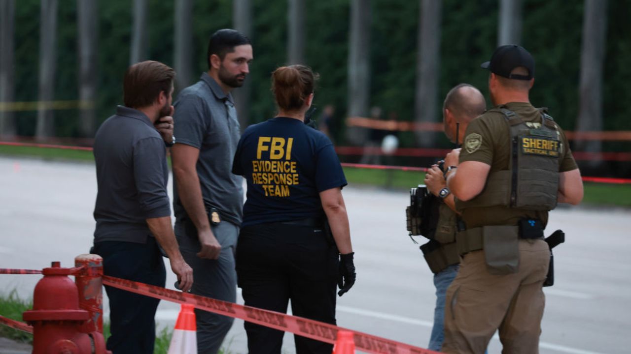 WEST PALM BEACH, FLORIDA - SEPTEMBER 15: Law enforcement personnel investigate the area around Trump International Golf Club after an apparent assassination attempt of former President Donald Trump on September 15, 2024 in West Palm Beach, Florida. The FBI and U.S. Secret Service, along with the Palm Beach County Sheriff's office, are investigating the incident, which the FBI said "appears to be an attempted assassination of former President Trump" while he was golfing at the course. (Photo by Joe Raedle/Getty Images)