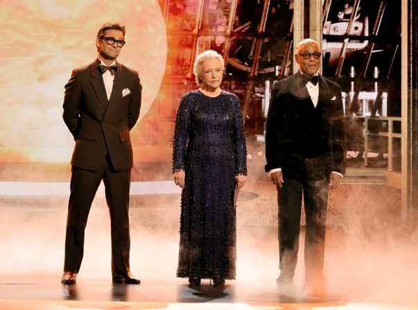 From left, Antony Starr, Kathy Bates and Giancarlo Esposito — who have played some iconic villains — speak on stage before presenting an award.