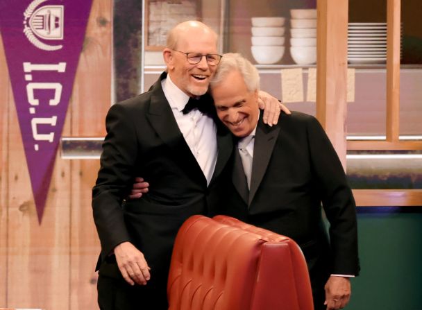 Ron Howard, left, embraces his former "Happy Days" co-star Henry Winkler before they <a href="https://www.cnn.com/entertainment/live-news/emmy-awards-levy-09-15-24#h_a79918f02171fac6f364096fd74b9893">teamed up to present an award.</a>