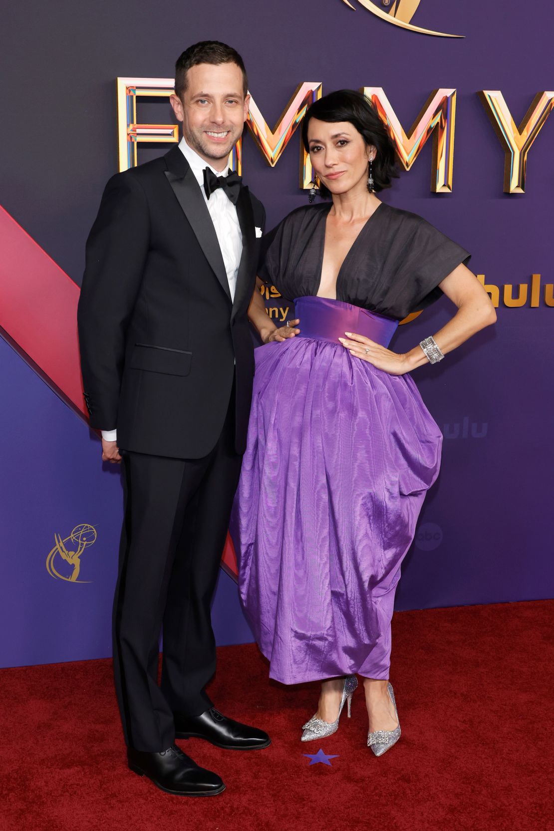 "Shōgun" creators Justin Marks and Rachel Kondo pose on the red carpet.