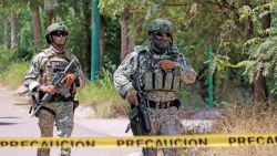 Soldiers of the Mexican Army stand guard as they secure an area during a military operation in Culiacan, Sinaloa State, Mexico, on September 19, 2024. Military forces and the National Guard carried out an operation in the Jardines de Santa Fe sector, Culiacan, whilst searching for "El Piyi", an important member of the Sinaloa Cartel, close to a criminal group known as Los Chapitos. (Photo by Ivan MEDINA / AFP) (Photo by IVAN MEDINA/AFP via Getty Images)