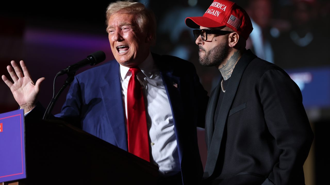 LAS VEGAS, NEVADA - SEPTEMBER 13: Republican presidential nominee, former U.S. President Donald Trump, (L) appears on stage with recording artist Nicky Jam during a campaign rally at The Expo at World Market Center Las Vegas on September 13, 2024 in Las Vegas, Nevada. With 53 days before election day, Former President Trump continues to campaign.  (Photo by Justin Sullivan/Getty Images)