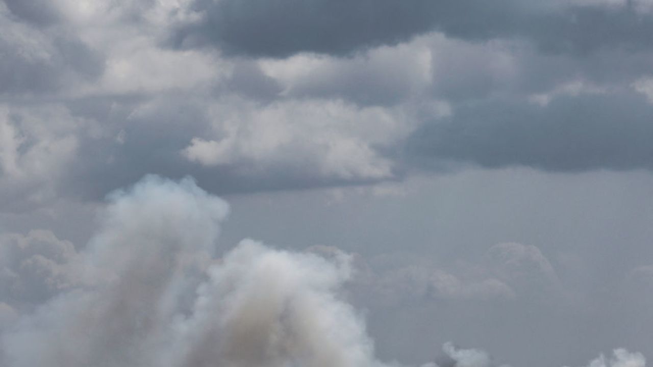 Smoke billows over hills in the Israeli-annexed Golan Heights after rockets were fired from southern Lebanon on September 20, 2024. Hezbollah said it fired barrages of rockets at Israeli military bases on September 20 in retaliation for strikes on south Lebanon, as tensions soared following deadly sabotage attacks on its communications devices. (Photo by Jalaa MAREY / AFP) (Photo by JALAA MAREY/AFP via Getty Images)