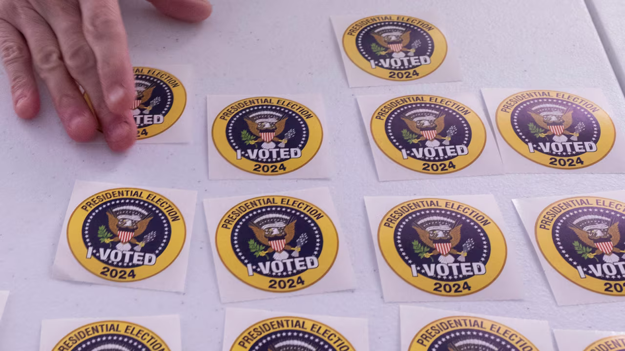 A voter picks up an "I Voted" sticker after casting an early ballot at a polling station in Arlington, Virginia, on September 20.