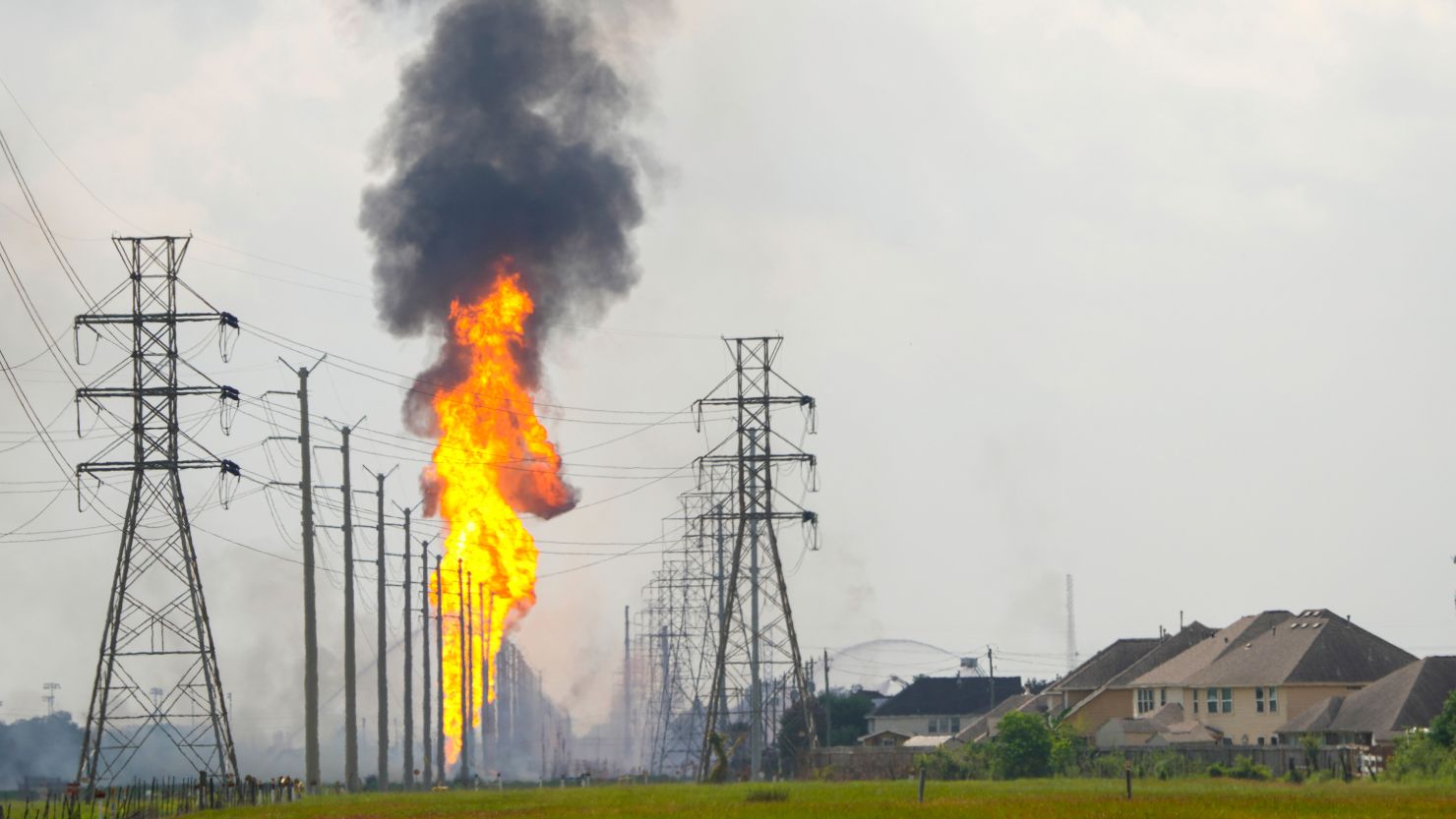 Flames burn from a pipeline along Spencer Highway in La Porte on Monday.