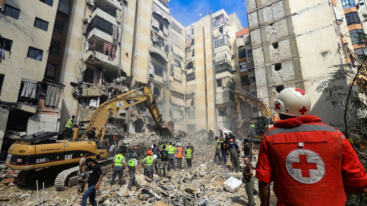 Rescuers sift through the rubble at the scene of an Israeli strike in Beirut on September 21.