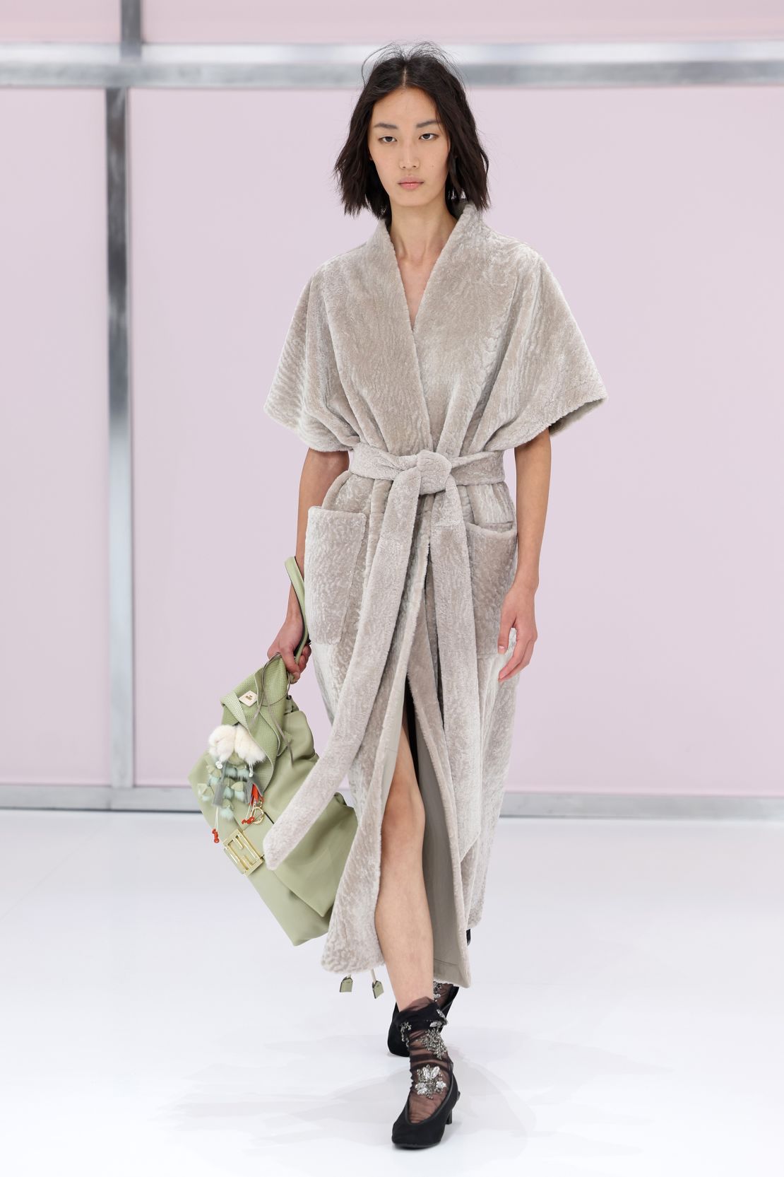 Elsewhere at Fendi, soft, bathrobe-like gowns — much like the one recently worn by Rihanna — were worn with sheer embroidered socks.