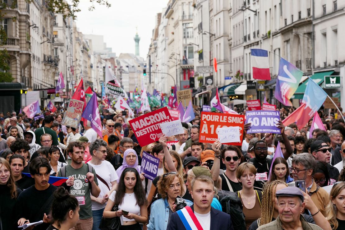 Protesters march through Paris during a demonstration against the "Macron-Barnier" government on September 21.