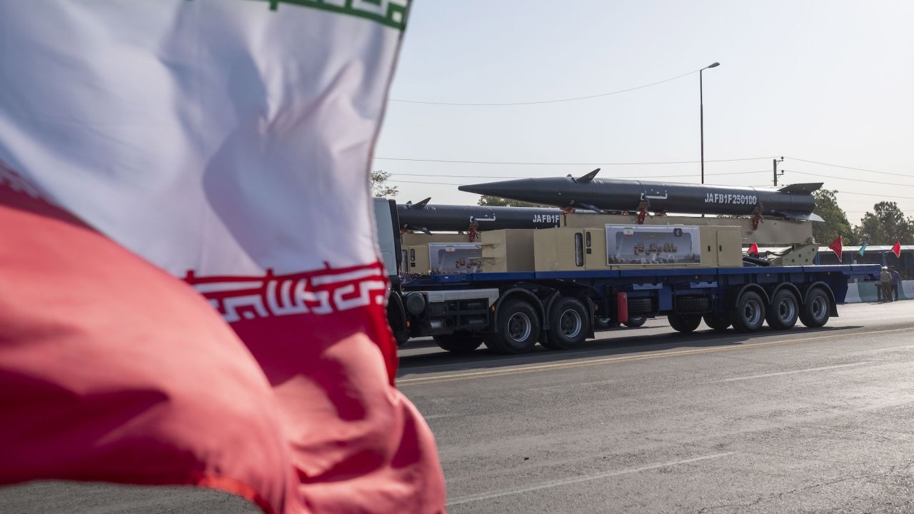 Iran's Fattah hypersonic missile is carried past an Iranian flag during a military parade in the south of Tehran, Iran, on September 21.