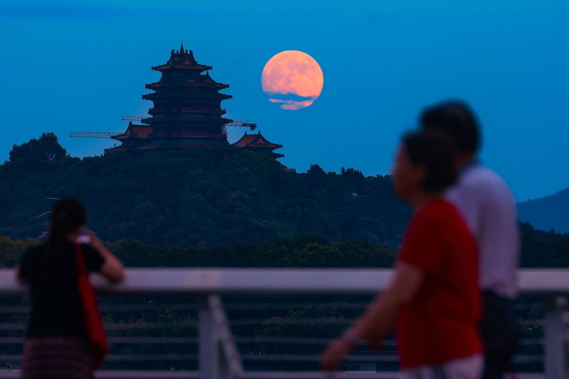 The moon rises in the sky Tuesday in Nanjing, China. Mid-Autumn Festival, which celebrates the moon, fell on September 17 this year.