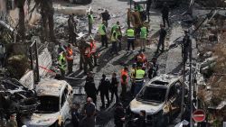 First responders and Israeli security forces gather amid debris and charred vehicles in Kiryat Bialik in the Haifa district of Israel, following a reported strike by Lebanon's Hezbollah on September 22, 2024. Hezbollah said on September 22 that it targeted military production facilities and an air base near north Israel's Haifa after the Israeli military pounded south Lebanon and said it targeted thousands of rocket launcher barrels. (Photo by Jack GUEZ / AFP) (Photo by JACK GUEZ/AFP via Getty Images)