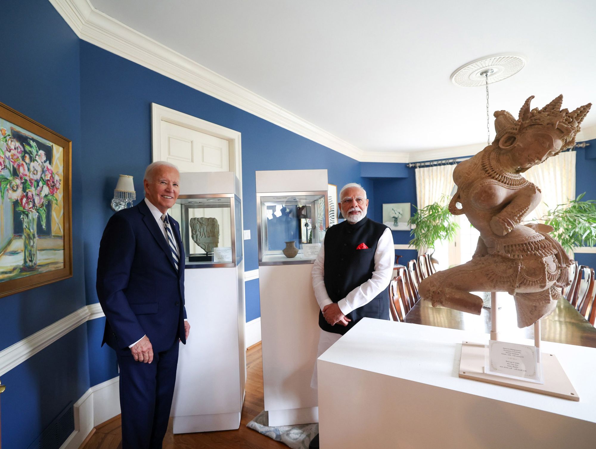 US President Joe Biden and Indian Prime Minister Narendra Modi pose in front of several artifacts that will be returned to India on September 21, 2024.